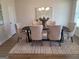 Elegant dining room with stylish chairs, light fixture, and neutral decor at 376 Collier Mills Road, Lawrenceville, GA 30045