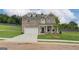Charming two-story brick home with well-manicured lawn and inviting covered porch at 376 Collier Mills Road, Lawrenceville, GA 30045