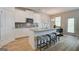 Modern kitchen with stainless steel appliances, granite countertops, and a center island at 376 Collier Mills Road, Lawrenceville, GA 30045
