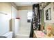 Small bathroom with shower/tub combo and outdated fixtures at 1826 E Farris Ave, East Point, GA 30344