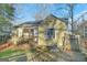 Side view of a yellow house with a porch at 1826 E Farris Ave, East Point, GA 30344