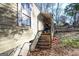 Yellow sided house with wooden steps and porch at 1826 E Farris Ave, East Point, GA 30344