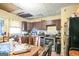 Kitchen with dark brown cabinets and stainless steel appliances at 1826 E Farris Ave, East Point, GA 30344