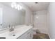 Basement bathroom with shower/tub and white vanity at 208 Tennis Court Nw Ln, Kennesaw, GA 30144