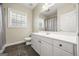 Clean bathroom with white vanity, tile floor, and shower at 1575 Little Lisa Ln, Snellville, GA 30078