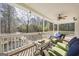 Cozy porch with seating area and wooded view at 1575 Little Lisa Ln, Snellville, GA 30078