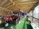 Game room with bar, artificial turf, and TVs at 7471 Ledgestone Ln, Riverdale, GA 30274