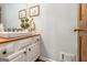 Updated bathroom with a white vanity and granite countertop at 203 Savannah Walk, Peachtree City, GA 30269