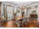 Bright dining room with hardwood floors and large windows at 203 Savannah Walk, Peachtree City, GA 30269