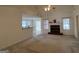 Living room with a fireplace and high ceiling with fan at 3013 Camille Ln, Mcdonough, GA 30253