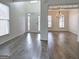 Bright foyer with hardwood floors, white trim, and large windows at 233 Yorkshire Ln, Villa Rica, GA 30180