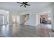 Bright, open-concept living area with hardwood floors and staircase at 233 Yorkshire Ln, Villa Rica, GA 30180