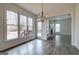 Bright living room has large windows, access to deck and wood floors at 233 Yorkshire Ln, Villa Rica, GA 30180