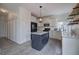Bright kitchen features a center island with countertop, white cabinets, stainless appliances, and stylish light fixtures at 233 Yorkshire Ln, Villa Rica, GA 30180