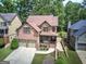 Aerial view of a two-story brick home with a well-maintained lawn and backyard at 233 Yorkshire Ln, Villa Rica, GA 30180