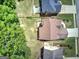Aerial view of home with a brown roof and a green yard surrounded by mature trees at 233 Yorkshire Ln, Villa Rica, GA 30180