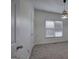 Bedroom showcasing natural light, soft carpet, and a modern light fixture at 233 Yorkshire Ln, Villa Rica, GA 30180