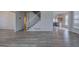 Open floor plan with hardwood floors, stairs, and kitchen view at 233 Yorkshire Ln, Villa Rica, GA 30180