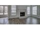 Bright living room with fireplace and ample windows, hardwood floors at 233 Yorkshire Ln, Villa Rica, GA 30180