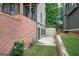 Side yard area enclosed by a brick wall, perfect for gardening or storage at 233 Yorkshire Ln, Villa Rica, GA 30180
