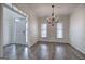 Elegant dining area with chandelier, hardwood floors, and natural light at 233 Yorkshire Ln, Villa Rica, GA 30180