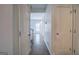 Inviting hallway view with wood-look flooring leading to a bright and open living area at 233 Yorkshire Ln, Villa Rica, GA 30180