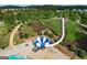 The community water slide with a splashdown pool is surrounded by landscaped gardens and seating at 233 Yorkshire Ln, Villa Rica, GA 30180