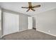 Bedroom with double closets and neutral decor at 7125 Flat Rock Se Trl, Covington, GA 30014