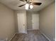 Spacious bedroom with ceiling fan and neutral carpet at 1139 Pine Mountain Dr, Forest Park, GA 30297