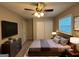 Main bedroom with ceiling fan, large closet, and neutral tones at 1139 Pine Mountain Dr, Forest Park, GA 30297