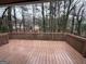 Spacious deck with a view of the backyard and surrounding trees at 1139 Pine Mountain Dr, Forest Park, GA 30297