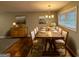 Bright dining room with rustic wood table and hardwood floors at 1139 Pine Mountain Dr, Forest Park, GA 30297
