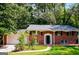 Brick ranch house with attached garage and covered porch at 1139 Pine Mountain Dr, Forest Park, GA 30297