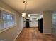 Eat-in kitchen with tiled floor and black appliances at 1139 Pine Mountain Dr, Forest Park, GA 30297