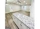 Bright and airy living room featuring hardwood floors and a ceiling fan at 663 Airport Rd, Oxford, GA 30054