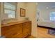 Mid-century dresser in bedroom with hardwood floors at 5117 Indie Se Cir, Covington, GA 30014