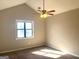 Bright bedroom with vaulted ceiling, carpet, and window at 5496 Orchard, Stone Mountain, GA 30083