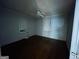 Bedroom with hardwood floors, a ceiling fan, and two windows offering natural light at 4692 College St, Forest Park, GA 30297