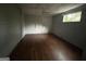Bedroom showcasing wood floors, a ceiling fan, and a window for natural light and ventilation at 4692 College St, Forest Park, GA 30297
