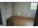 Bedroom with peeling paint and one window at 4692 College St, Forest Park, GA 30297