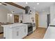 Modern kitchen with white cabinets and a large island at 311 Newfield Way, Peachtree City, GA 30269