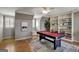 Game room with pool table and built-in bookshelves at 131 Cloister Dr, Peachtree City, GA 30269