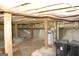Unfinished basement space with wooden beams and concrete foundation, ready for personalized updates at 3013 Pommel Ct, Conyers, GA 30013