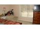 This bedroom includes a sitting area, dresser, and window with blinds at 3013 Pommel Ct, Conyers, GA 30013