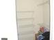 Bright walk-in closet features ample shelving to maximize storage capabilities at 3013 Pommel Ct, Conyers, GA 30013