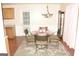 Dining room featuring a glass table set and decorative chandelier at 3013 Pommel Ct, Conyers, GA 30013