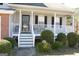 Charming front porch with white railings and steps, and a black front door at 3013 Pommel Ct, Conyers, GA 30013