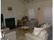 Living room with fireplace and vaulted ceilings, featuring neutral-toned furniture at 3013 Pommel Ct, Conyers, GA 30013