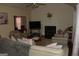 Living room with fireplace and vaulted ceilings, featuring neutral-toned furniture at 3013 Pommel Ct, Conyers, GA 30013