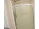 Bright bathroom shower features a glass door and adjustable shower head at 3013 Pommel Ct, Conyers, GA 30013